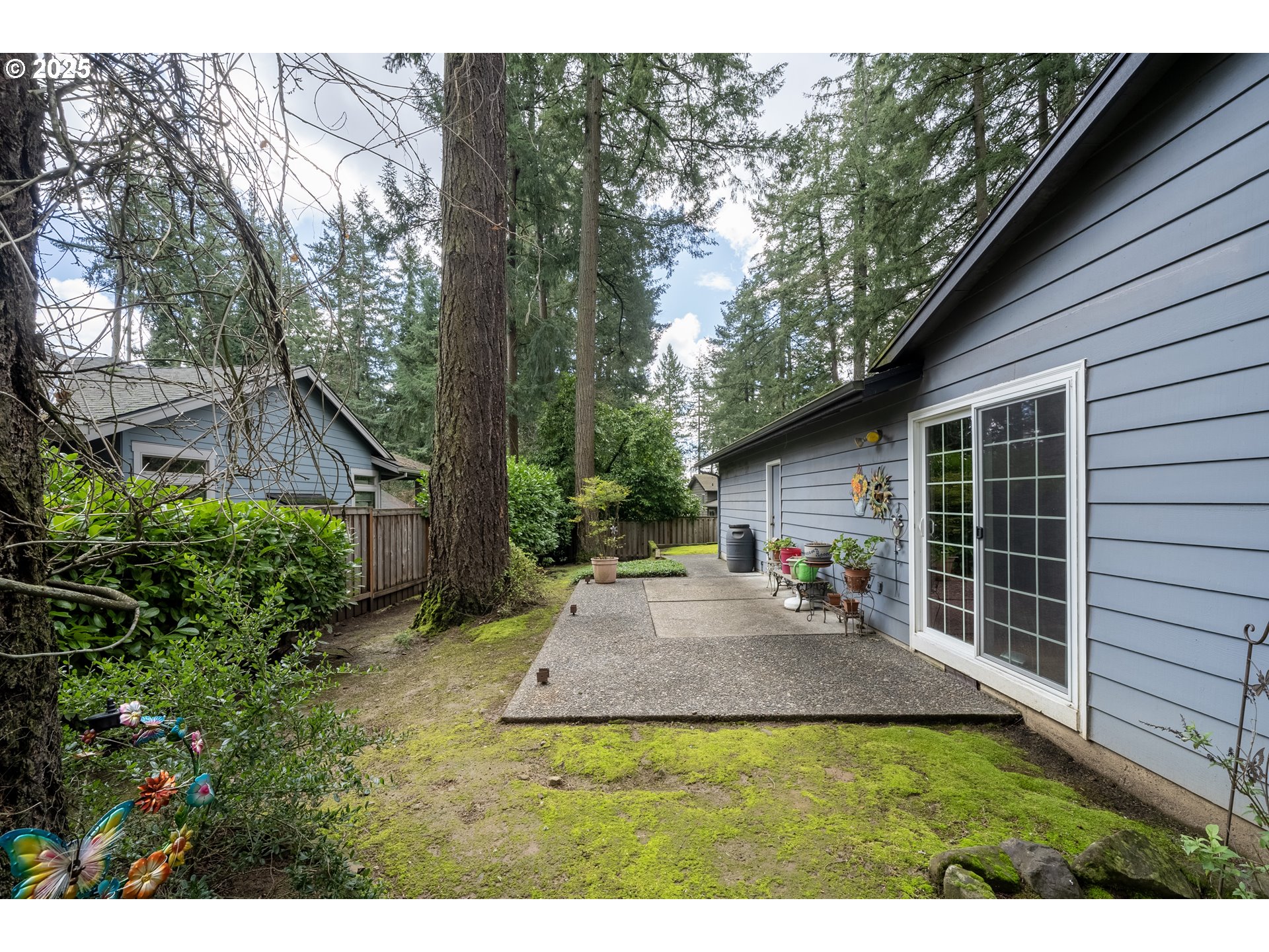 16808 Southwest Inverurie Road Lake Oswego, OR 97035 - Photo 34 of 38 a view of backyard of house with wooden deck and outdoor seating