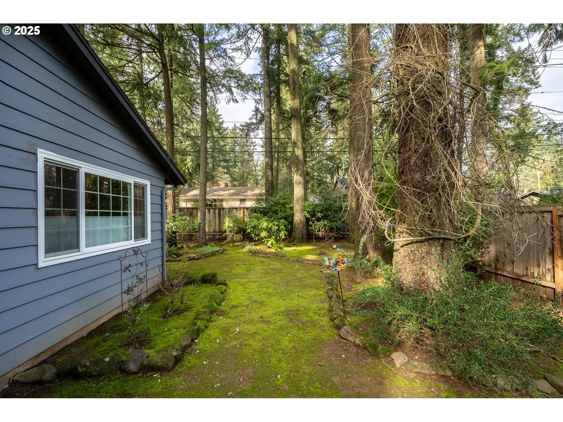 16808 Southwest Inverurie Road Lake Oswego, OR 97035 - Photo 35 of 38 a view of backyard of house with green space