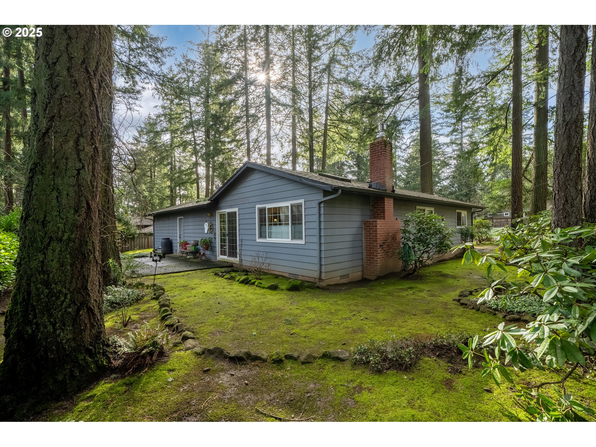 16808 Southwest Inverurie Road Lake Oswego, OR 97035 - Photo 36 of 38 a backyard of a house with wooden floor and tree