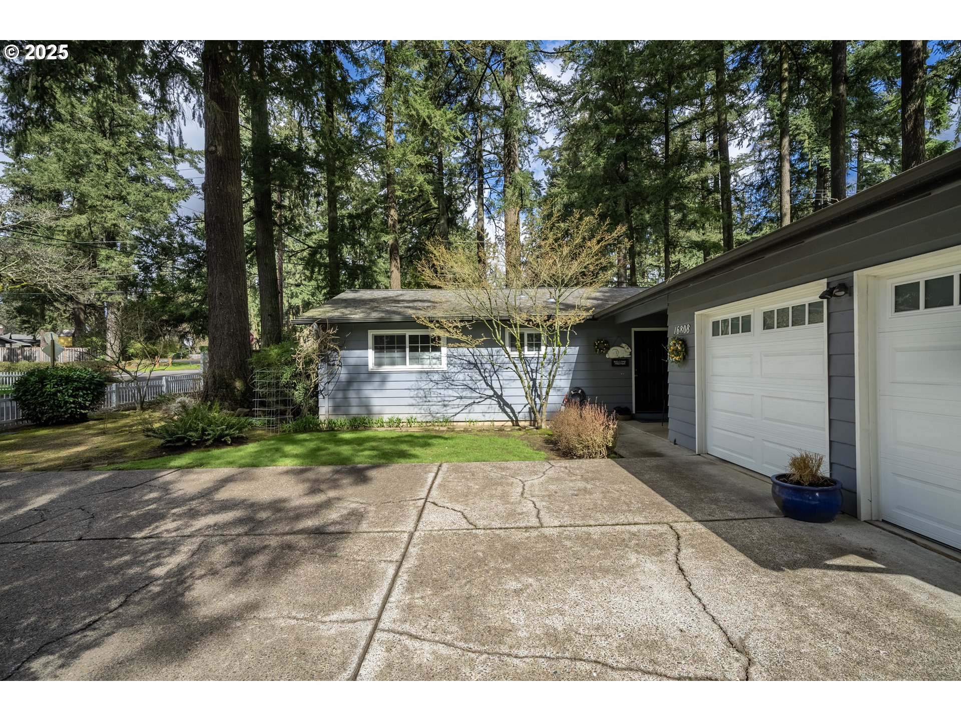 16808 Southwest Inverurie Road Lake Oswego, OR 97035 - Photo 4 of 38 a view of a house with backyard and garden