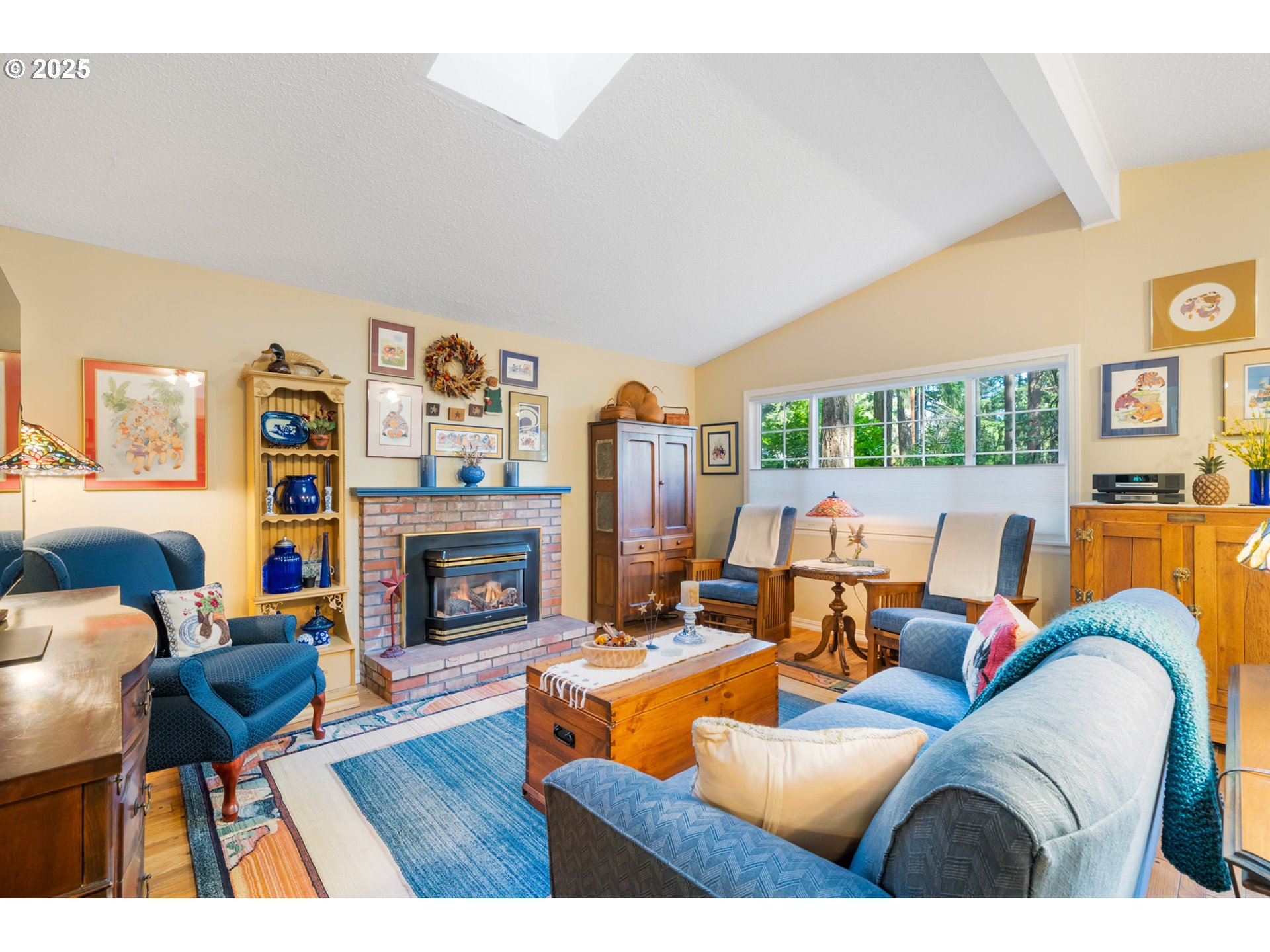16808 Southwest Inverurie Road Lake Oswego, OR 97035 - Photo 8 of 38 a living room with fireplace furniture and a fireplace