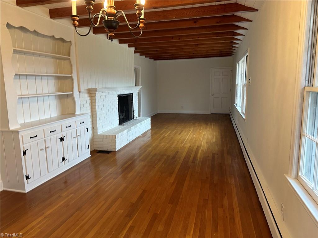 410 Doub Road Lewisville, NC 27023 - Photo 7 of 10 Built -ins and Hardwood s gas fireplace