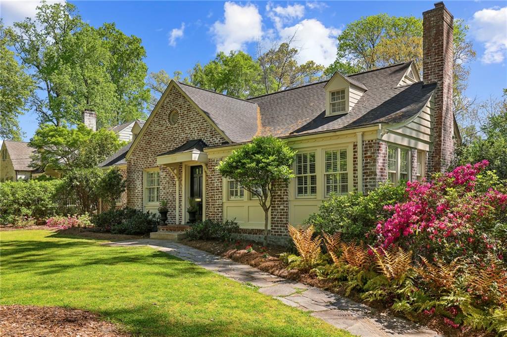 225 Huntington Road Northeast Atlanta, GA 30309 - Photo 1 of 1 a front view of a house with a yard
