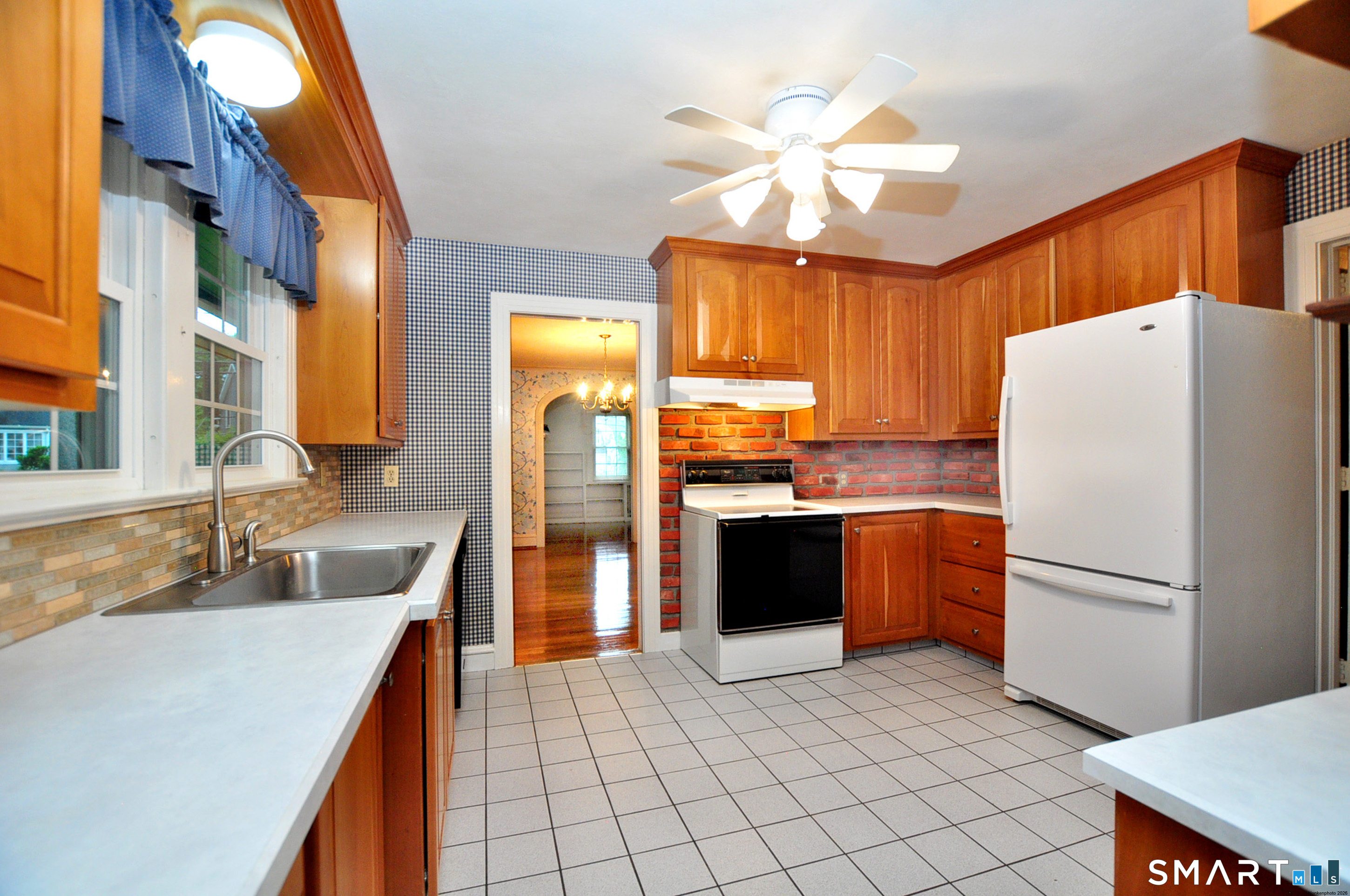 10 Harvey Road Windsor, CT 06095 - Photo 12 of 36 a kitchen with granite countertop a refrigerator a sink a stove and island