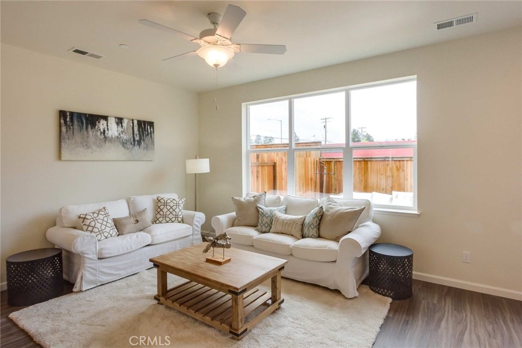 a living room with furniture and a window