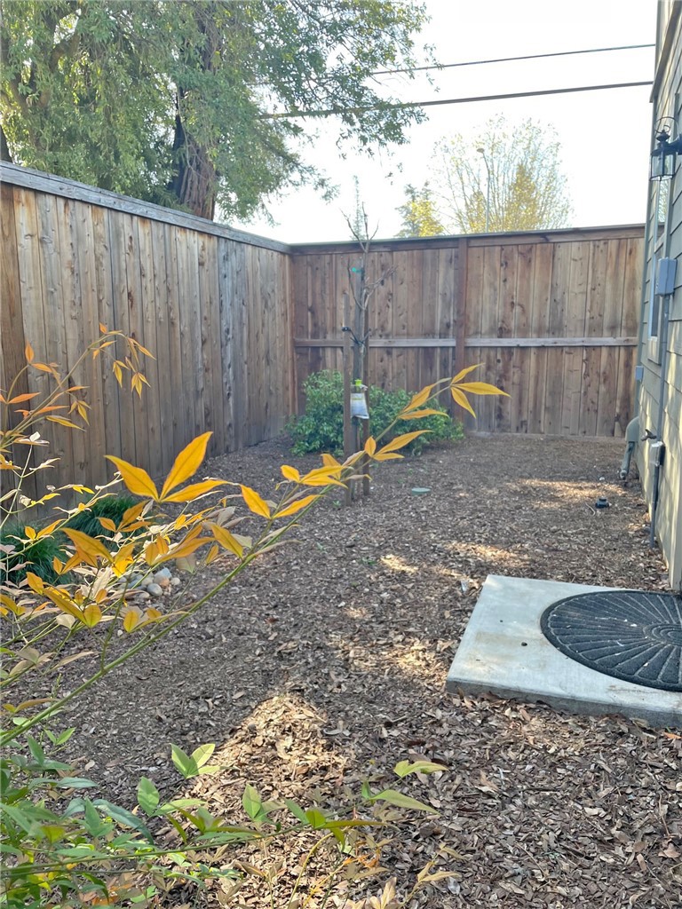 2010 Ravello Way Santa Rosa, CA 95403 - Photo 12 of 14 a view of a backyard with plants and wooden fence