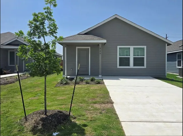 a house with yard in front of it