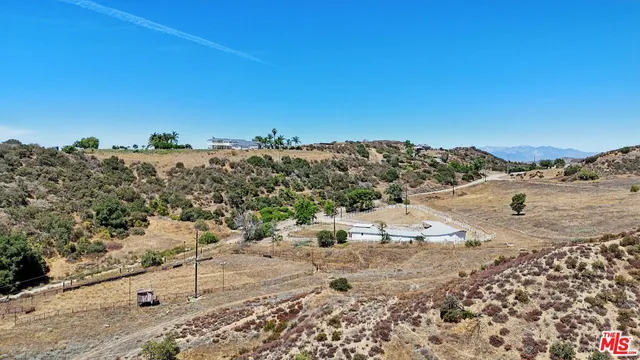 a lobby with furniture and a floor to ceiling window