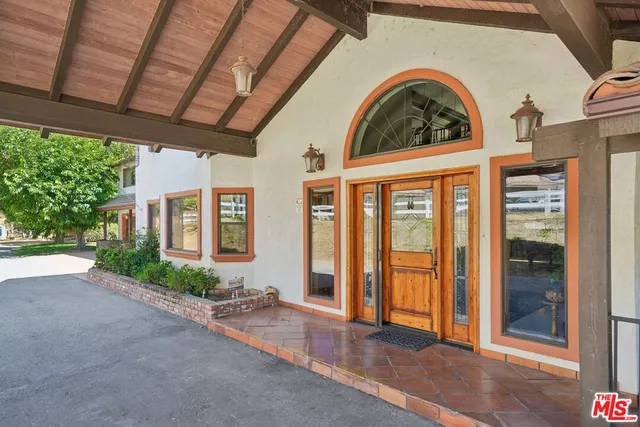 a view of a brick house with a large window