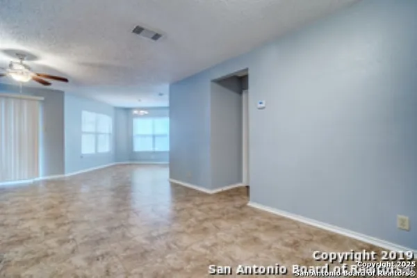 a view of an empty room and window