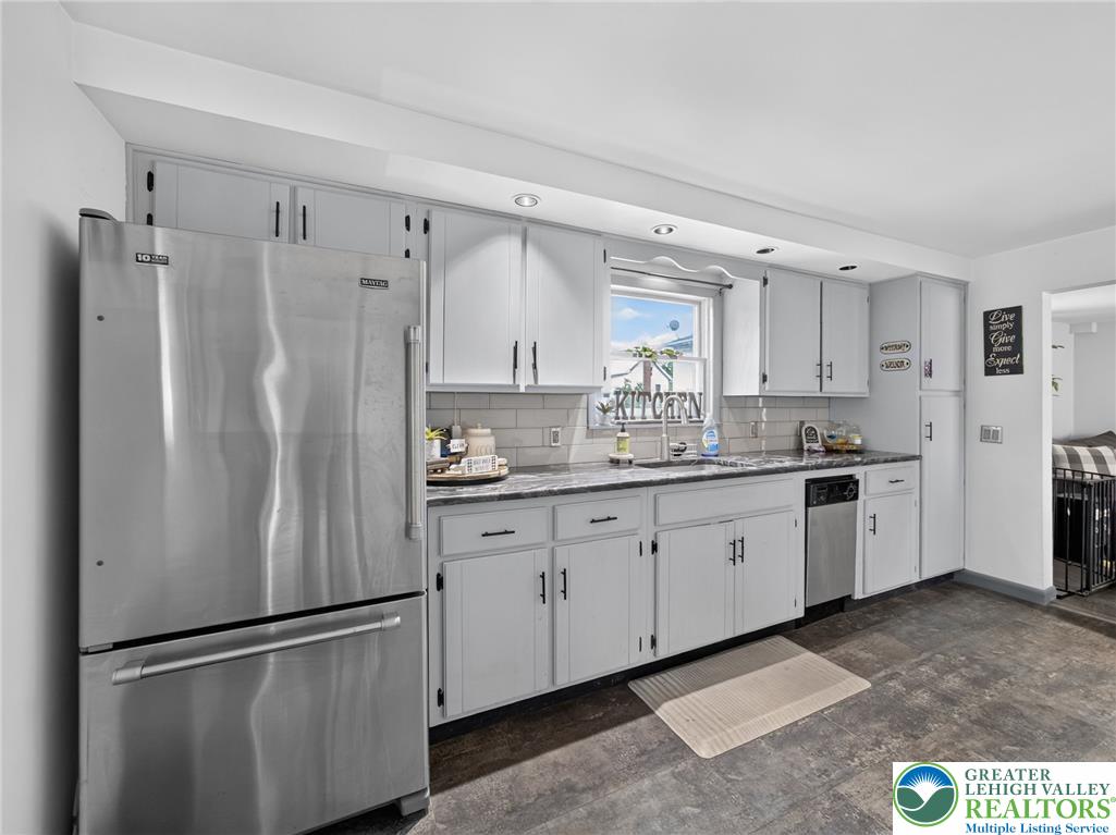 2628 Levans Road Coplay, PA 18037 - Photo 17 of 54 A well-appointed kitchen features stainless steel appliances and light cabinetry for a clean aesthetic.