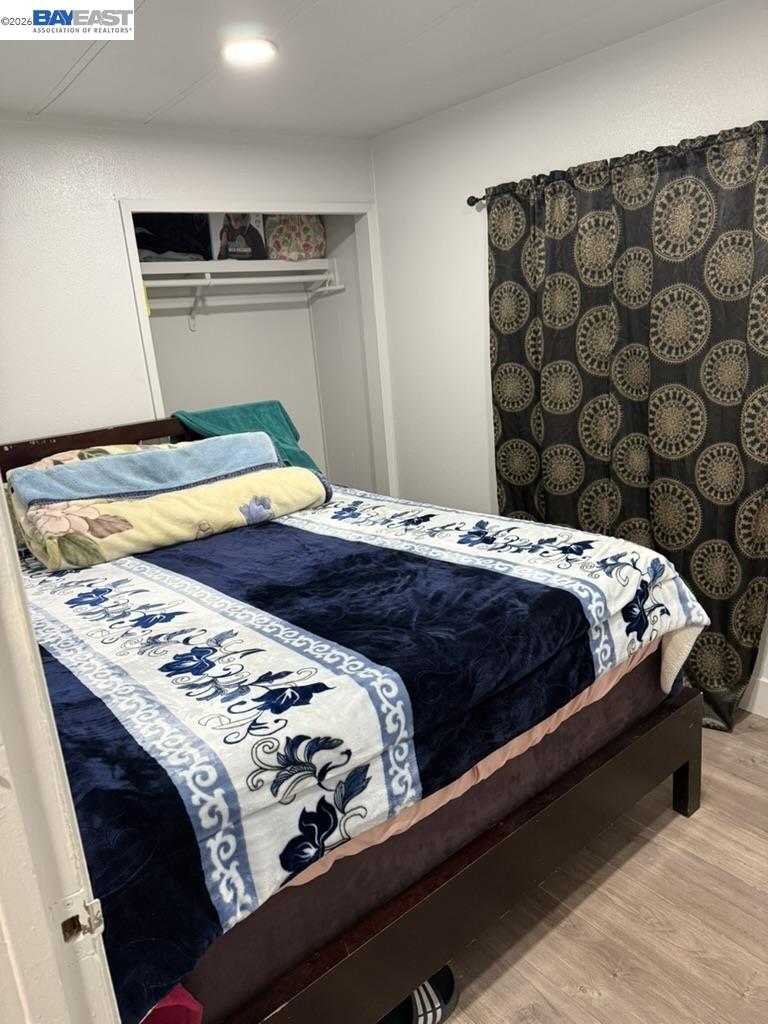 4404 Raiders Way, Unit 81 Modesto, CA 95355 - Photo 12 of 17 a bedroom with a bed and curtain