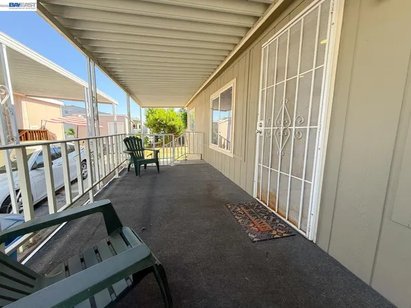 a view of a porch with furniture