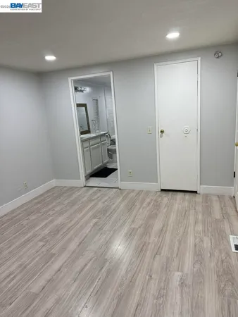 a view of a livingroom with wooden floor