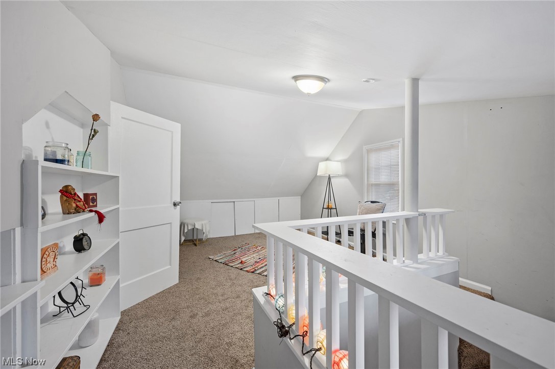 3305 Kildare Road Cleveland, OH 44118 - Photo 22 of 33 Hallway featuring lofted ceiling and light carpet