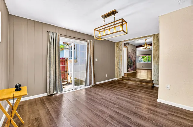 a kitchen with stainless steel appliances granite countertop a refrigerator sink and stove