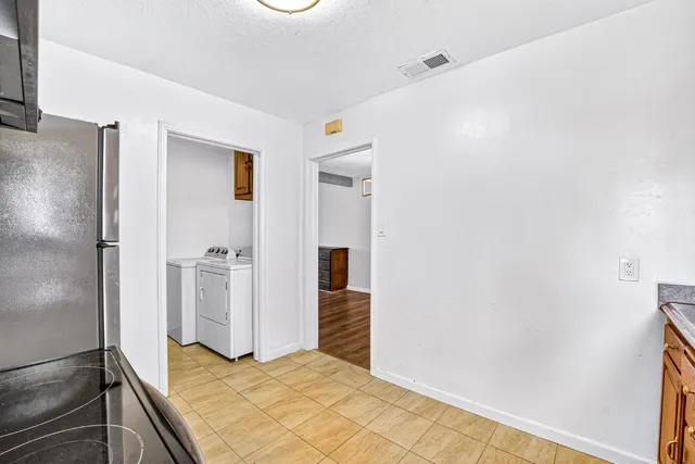 a bedroom with bed and a window