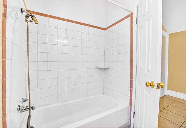 an aerial view of a house with a yard basket ball court and outdoor seating
