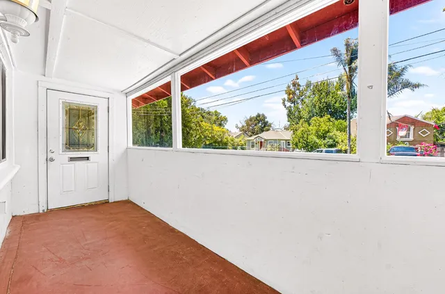 a living room with fireplace furniture and a flat screen tv