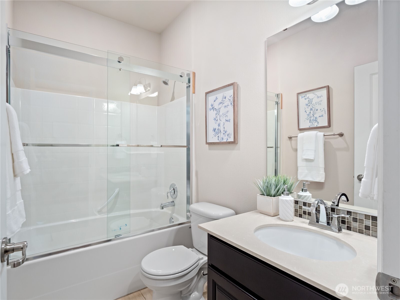 3923 186th Place Southeast Bothell, WA 98012 - Photo 16 of 40 a bathroom with a sink a toilet and shower
