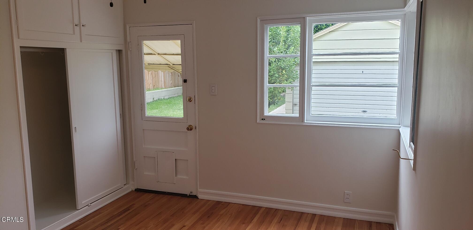 1130 Heather Square Pasadena, CA 91104 - Photo 5 of 12 a view of an empty room with wooden floor and a window