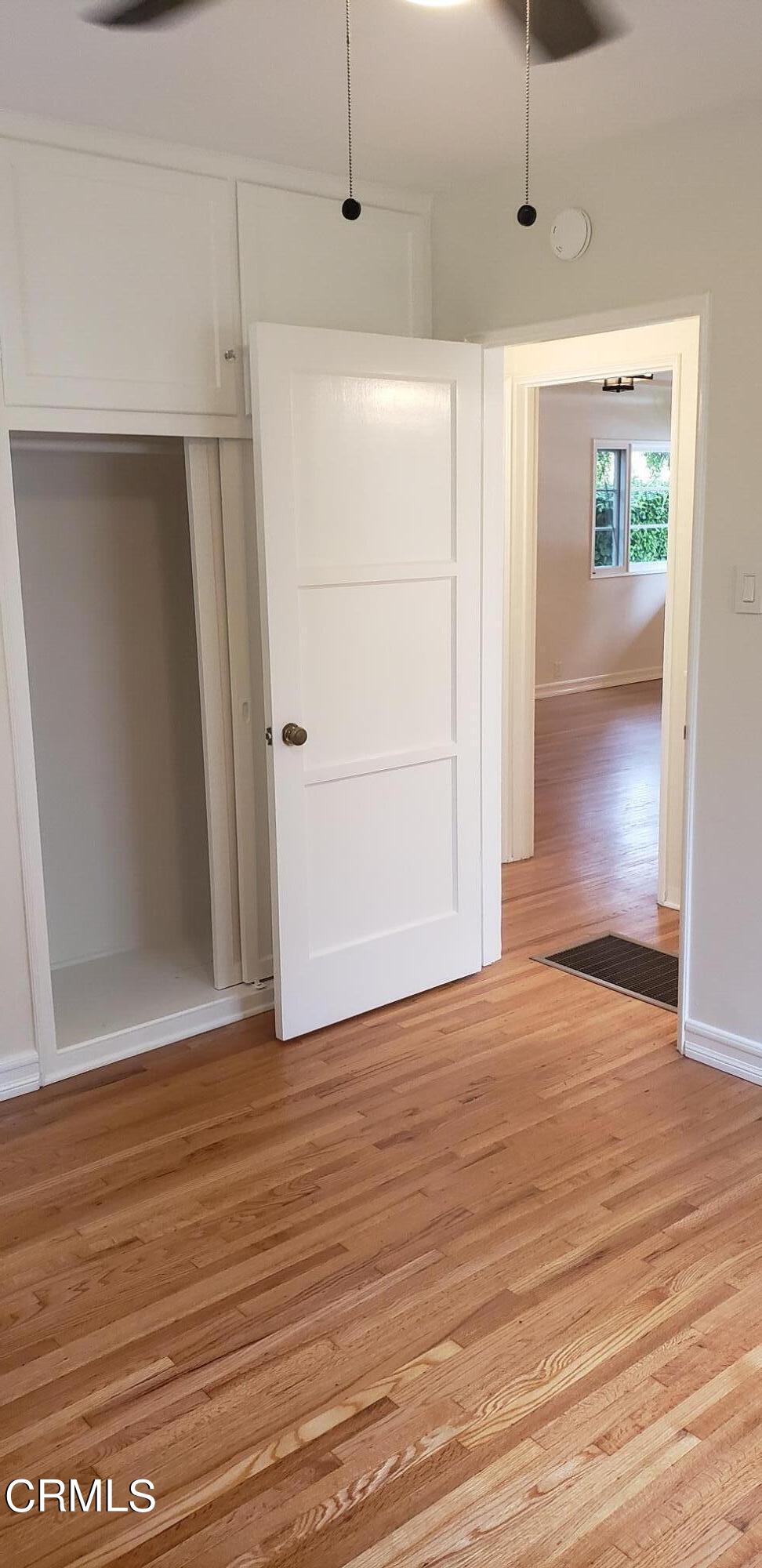 1130 Heather Square Pasadena, CA 91104 - Photo 6 of 12 a view of an empty room with wooden floor