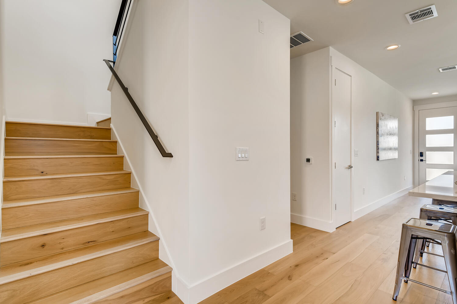 505 Kemp Street Austin, TX 78741 - Photo 17 of 34 Upstairs will take you to the two secondary bedrooms.