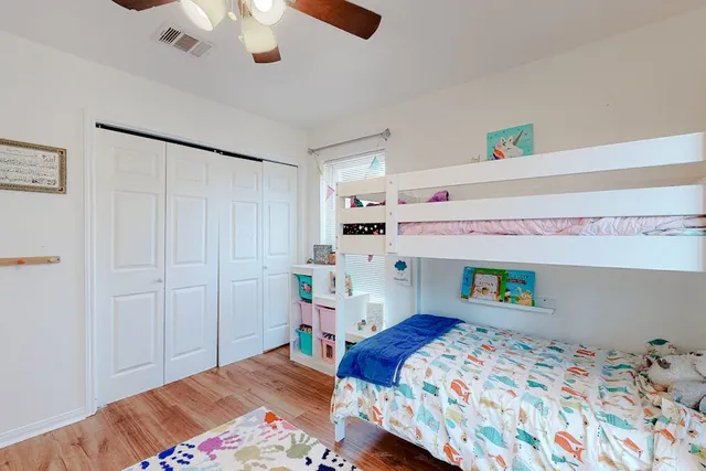a bedroom with a bed and a dresser in it