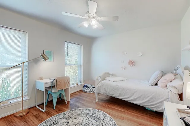 a bedroom with a bed and a table in it