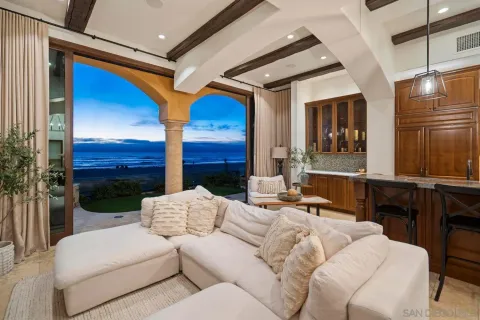 a balcony with furniture and a fireplace