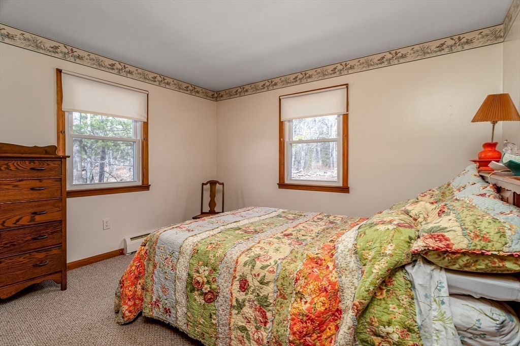 73 Spur Road Dover, NH 03820 - Photo 17 of 26 a bedroom with a bed and window