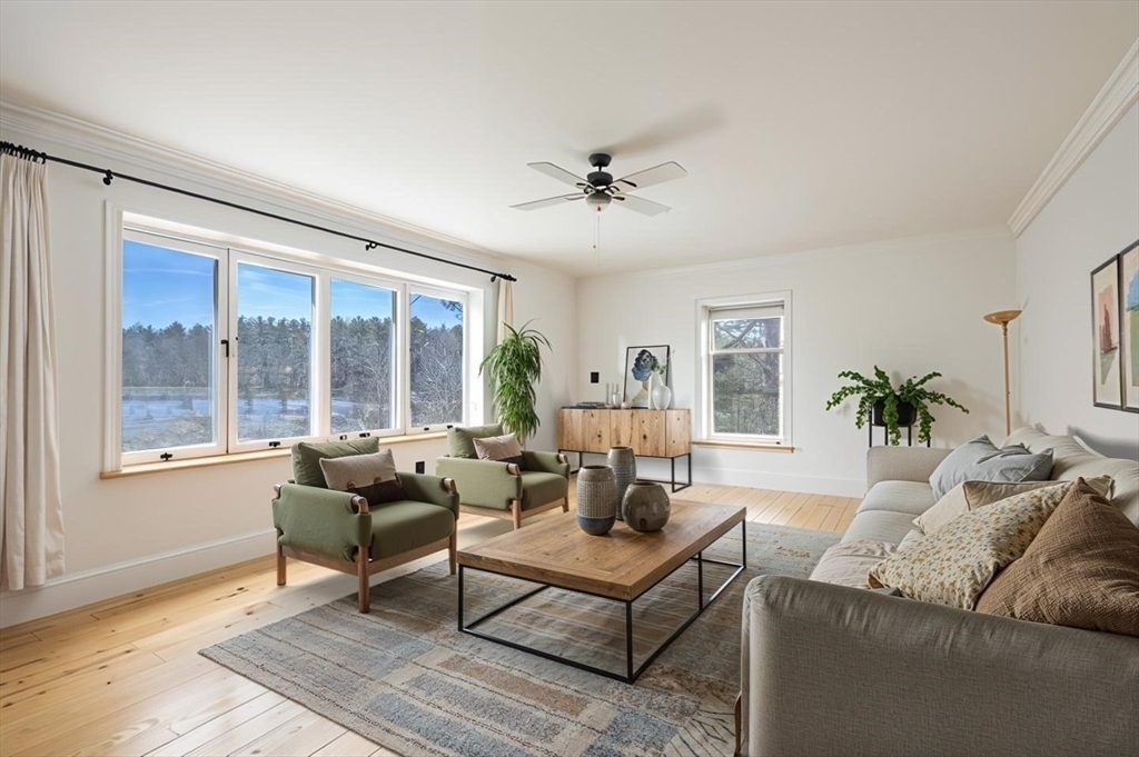 73 Spur Road Dover, NH 03820 - Photo 5 of 26 a living room with furniture and a large window