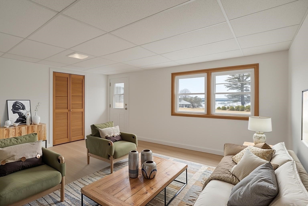 73 Spur Road Dover, NH 03820 - Photo 6 of 26 a living room with furniture and a window