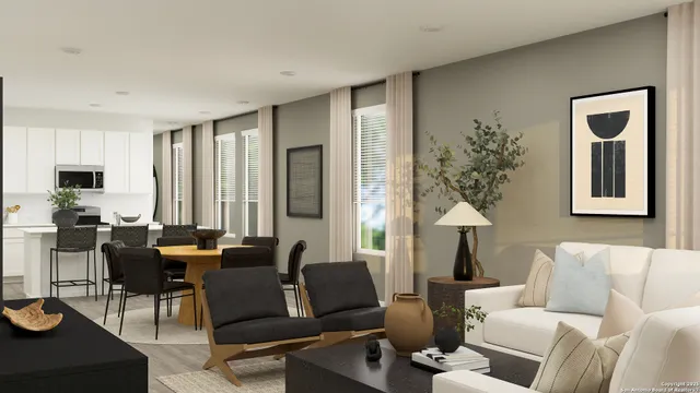 a living room with furniture and a potted plant