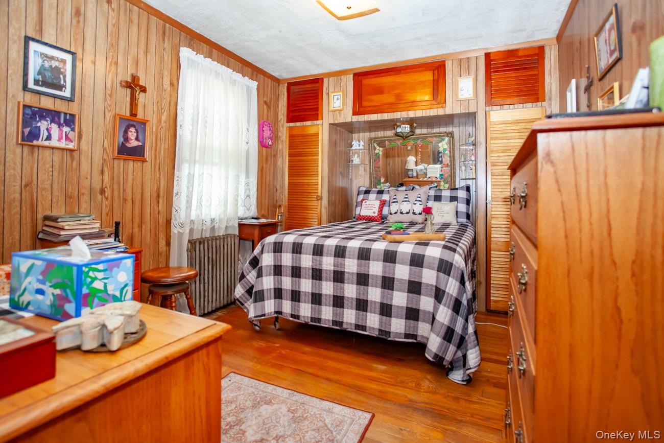 211 Broadway Verplanck, NY 10596 - Photo 11 of 48 a bedroom with a bed and a window