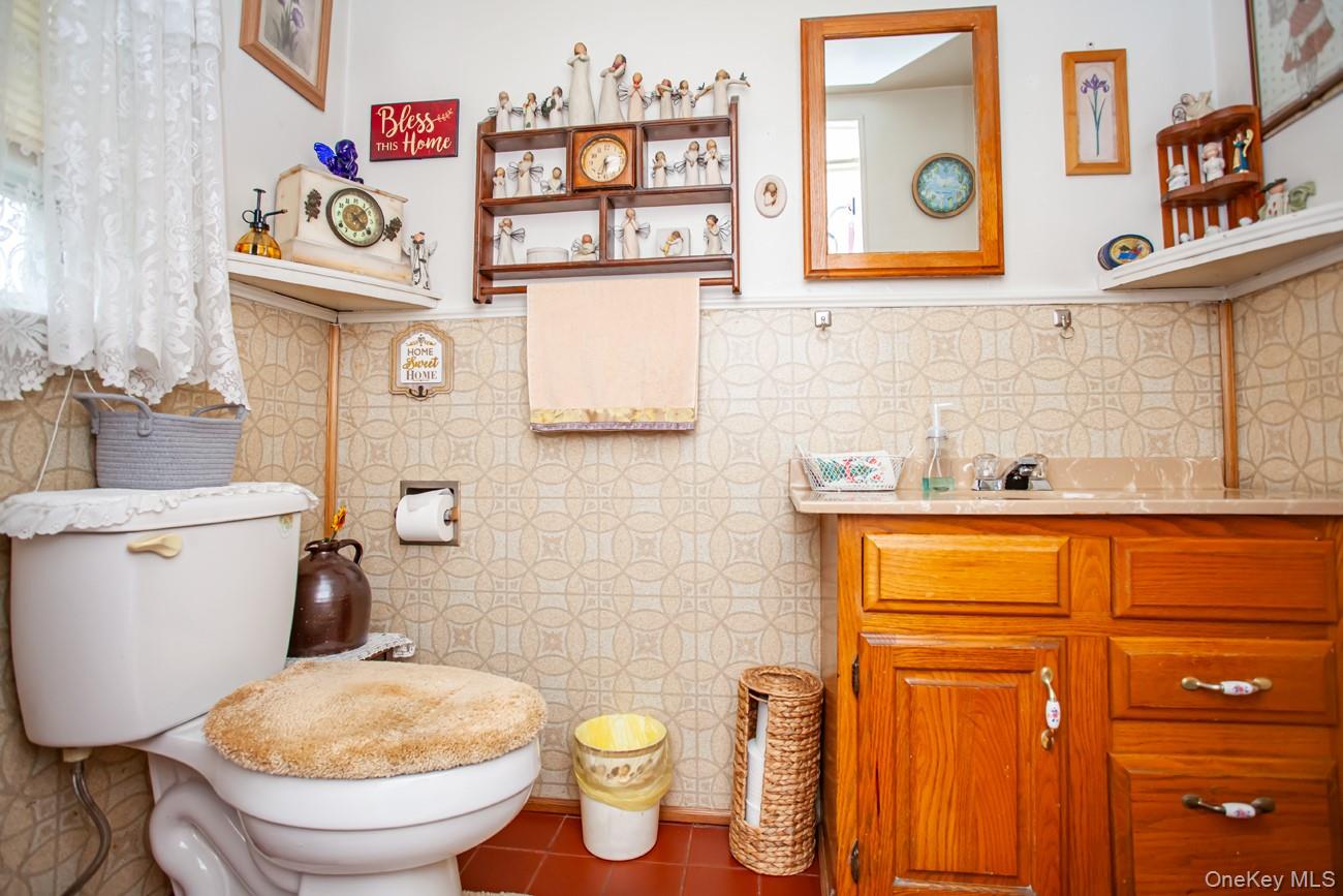 211 Broadway Verplanck, NY 10596 - Photo 13 of 48 a bathroom with a toilet sink and mirror