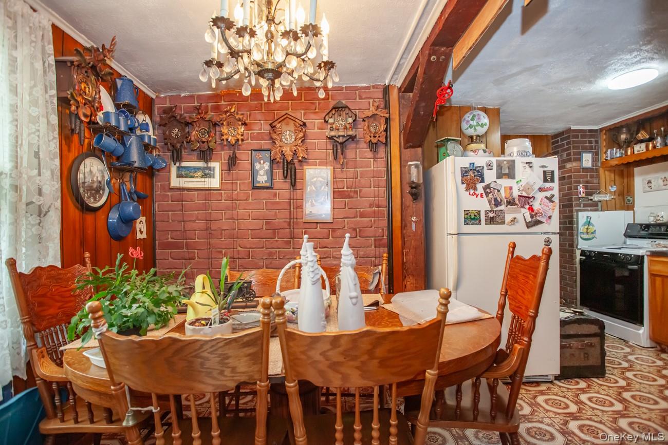 211 Broadway Verplanck, NY 10596 - Photo 17 of 48 a view of a dining room with furniture and wooden floor