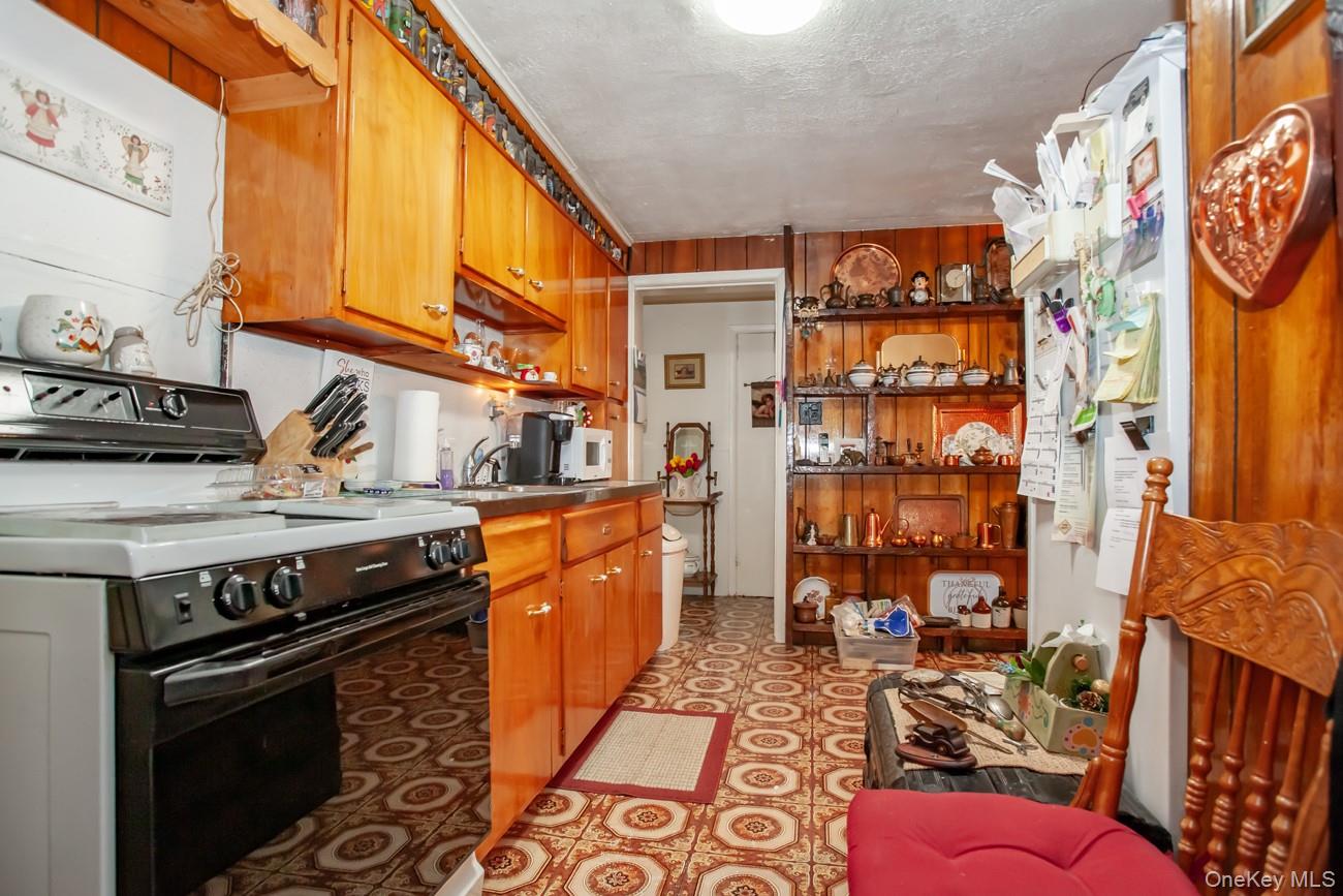 211 Broadway Verplanck, NY 10596 - Photo 21 of 48 a kitchen with stainless steel appliances granite countertop a stove a sink and a microwave