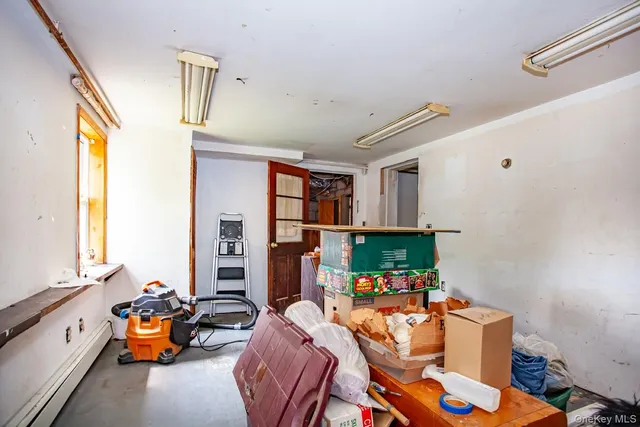 a utility room with dryer washer and a wooden floor