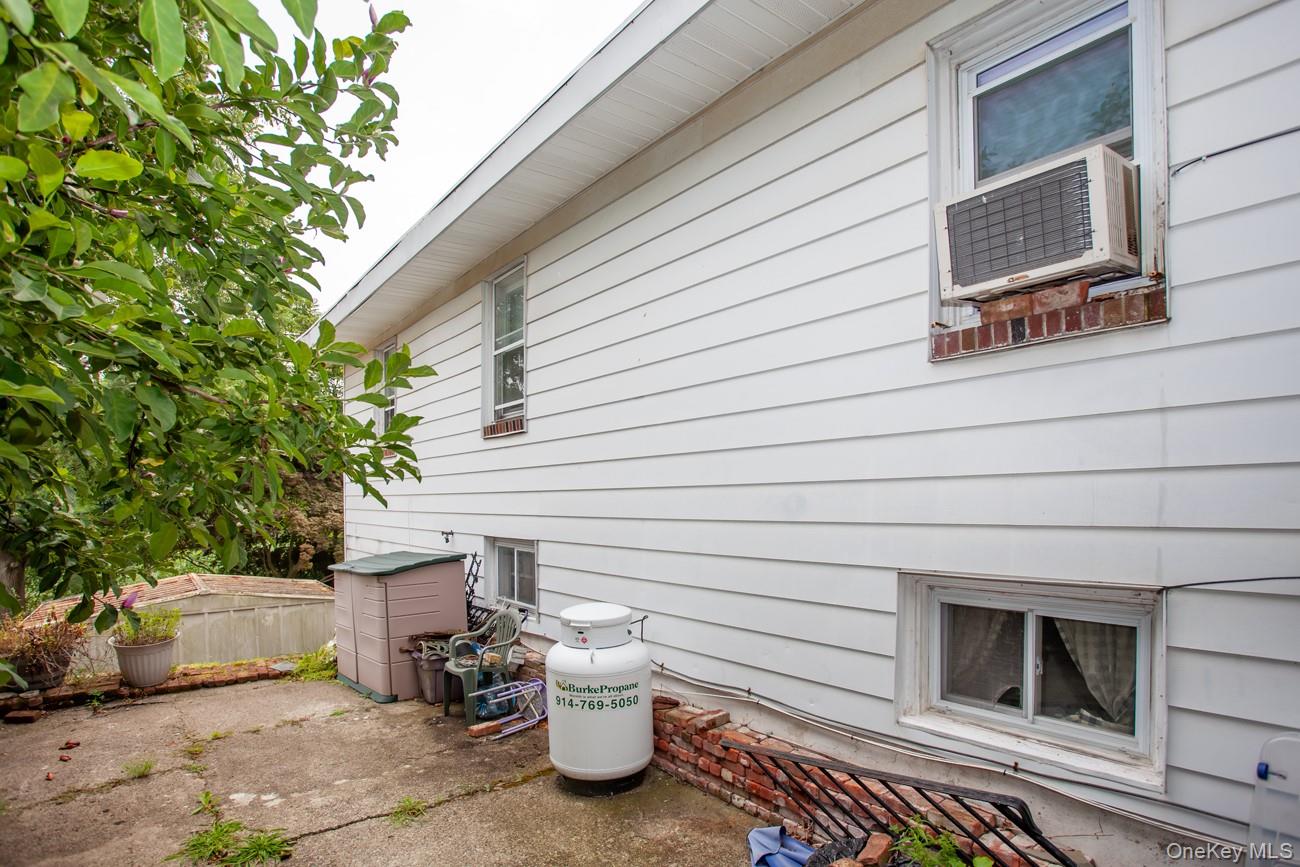 211 Broadway Verplanck, NY 10596 - Photo 41 of 48 a view of a patio with table and chairs with wooden fence and plants