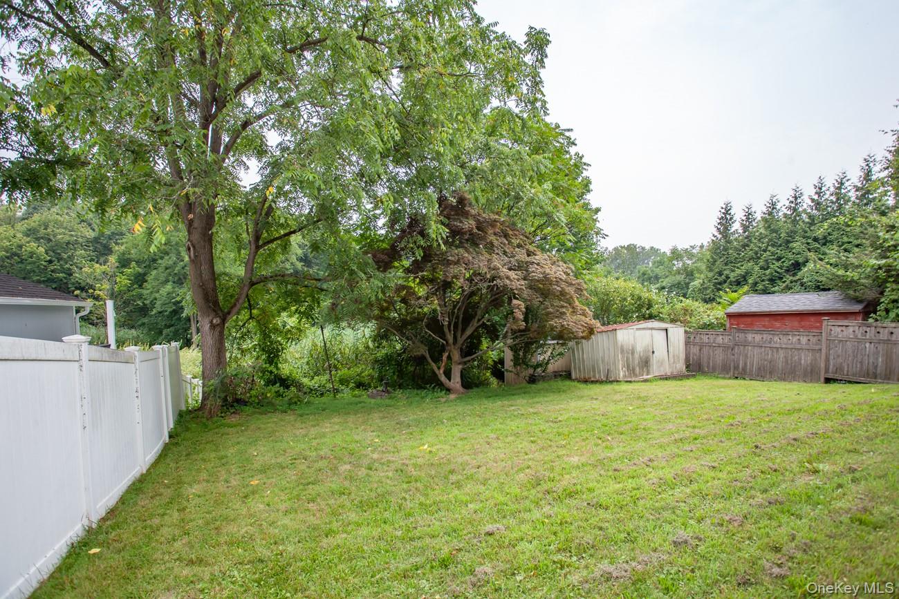211 Broadway Verplanck, NY 10596 - Photo 42 of 48 a view of a backyard with a small cabin