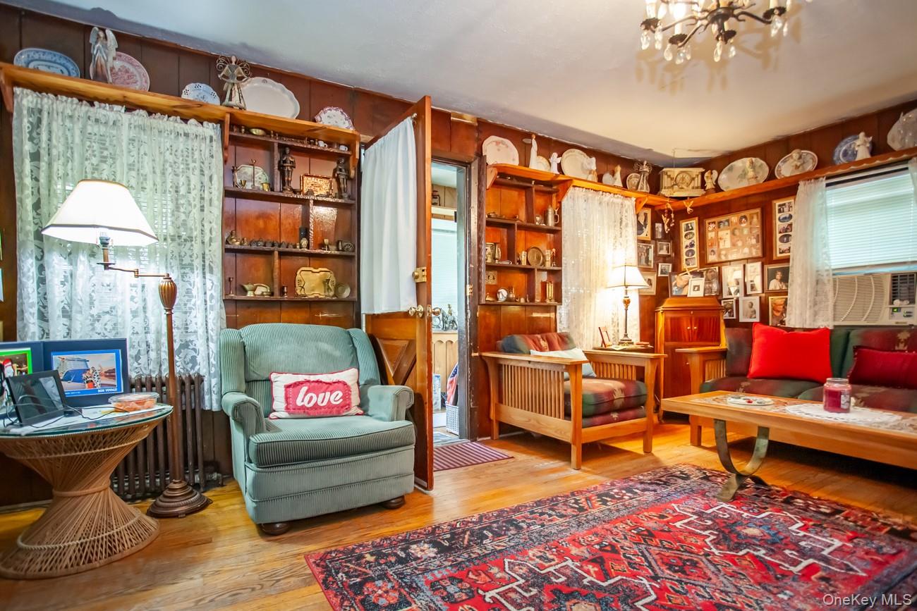 211 Broadway Verplanck, NY 10596 - Photo 7 of 48 a living room with furniture a rug and a chandelier