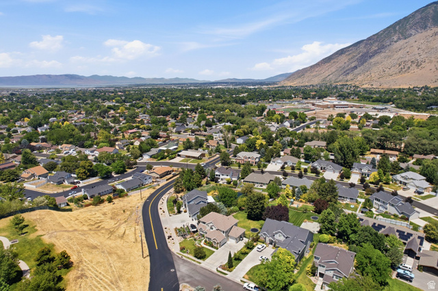 1263 East 1200th South Springville, UT 84663 - Photo 56 of 60 Expansive aerial panorama showcasing a residential community with mature trees and mountain scenery