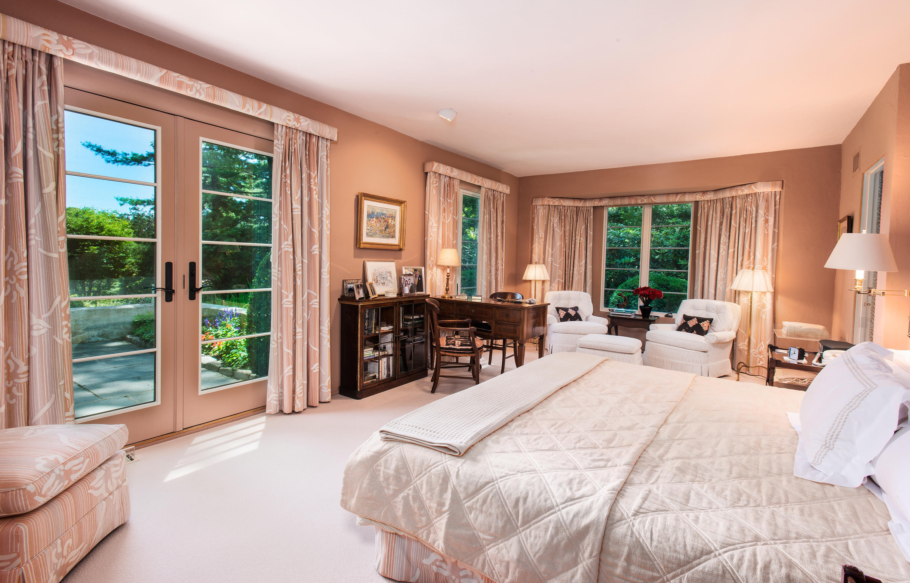 11 Contentment Island Road Darien, CT 06820 - Photo 15 of 31 a bedroom with a bed and large windows