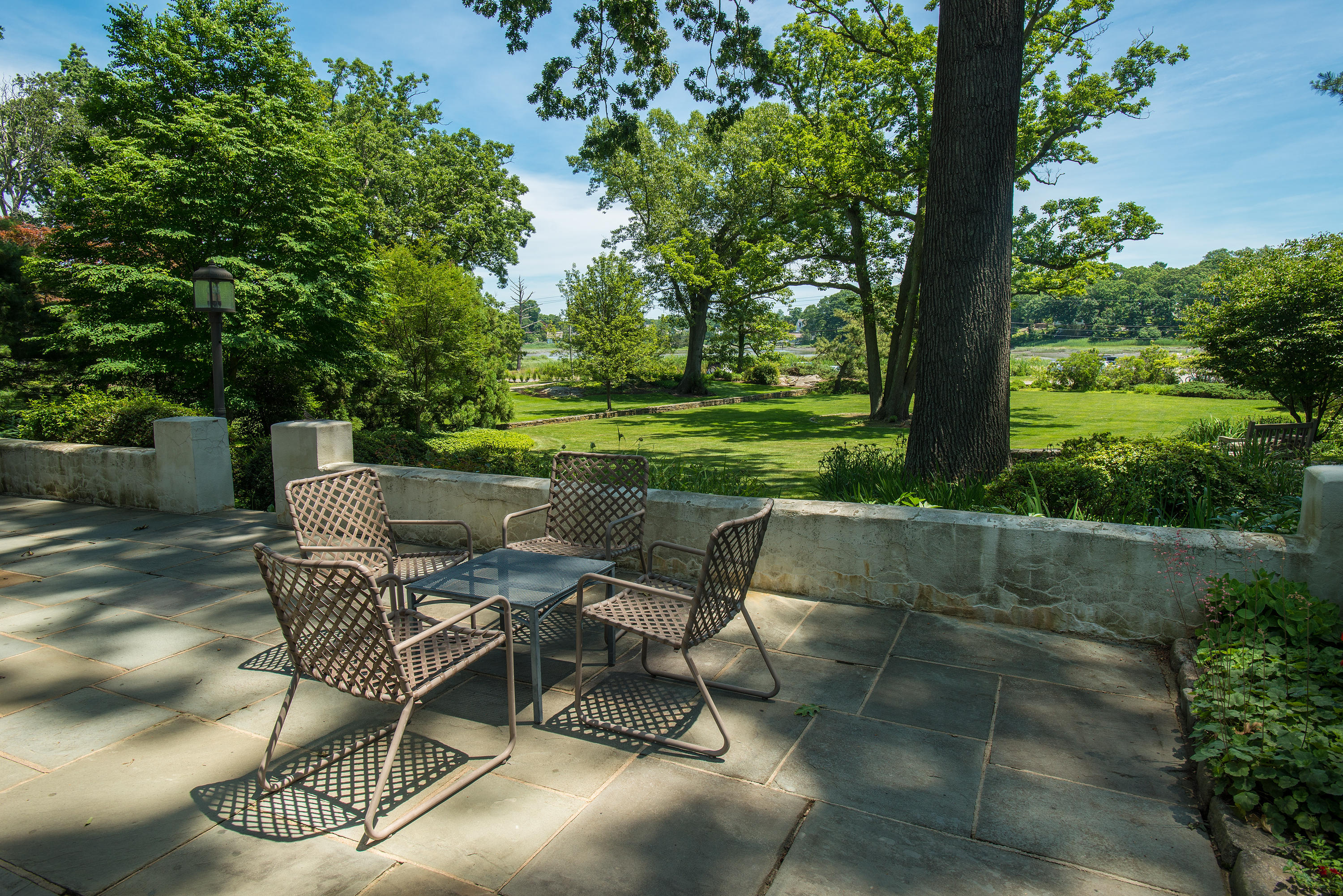 11 Contentment Island Road Darien, CT 06820 - Photo 20 of 31 a view of a chairs and table in the patio