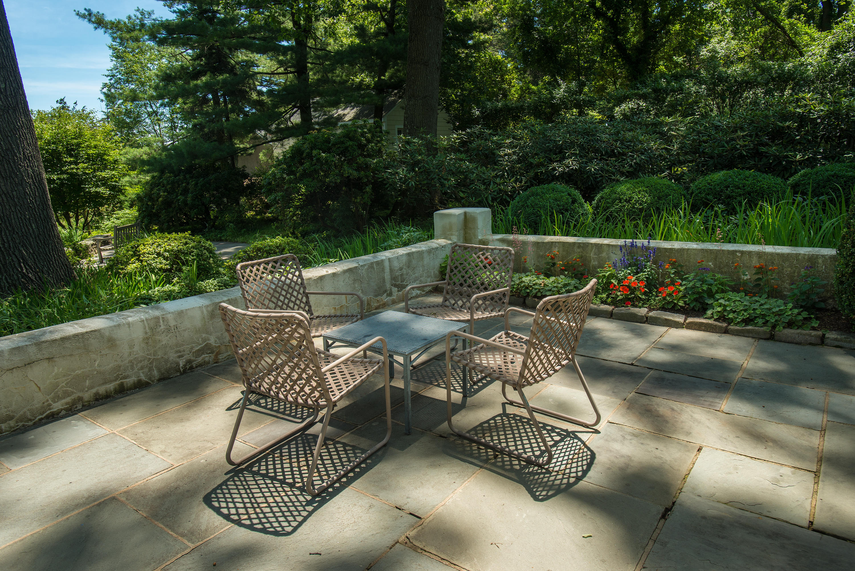 11 Contentment Island Road Darien, CT 06820 - Photo 23 of 31 a view of a patio with couches table and chairs and potted plants