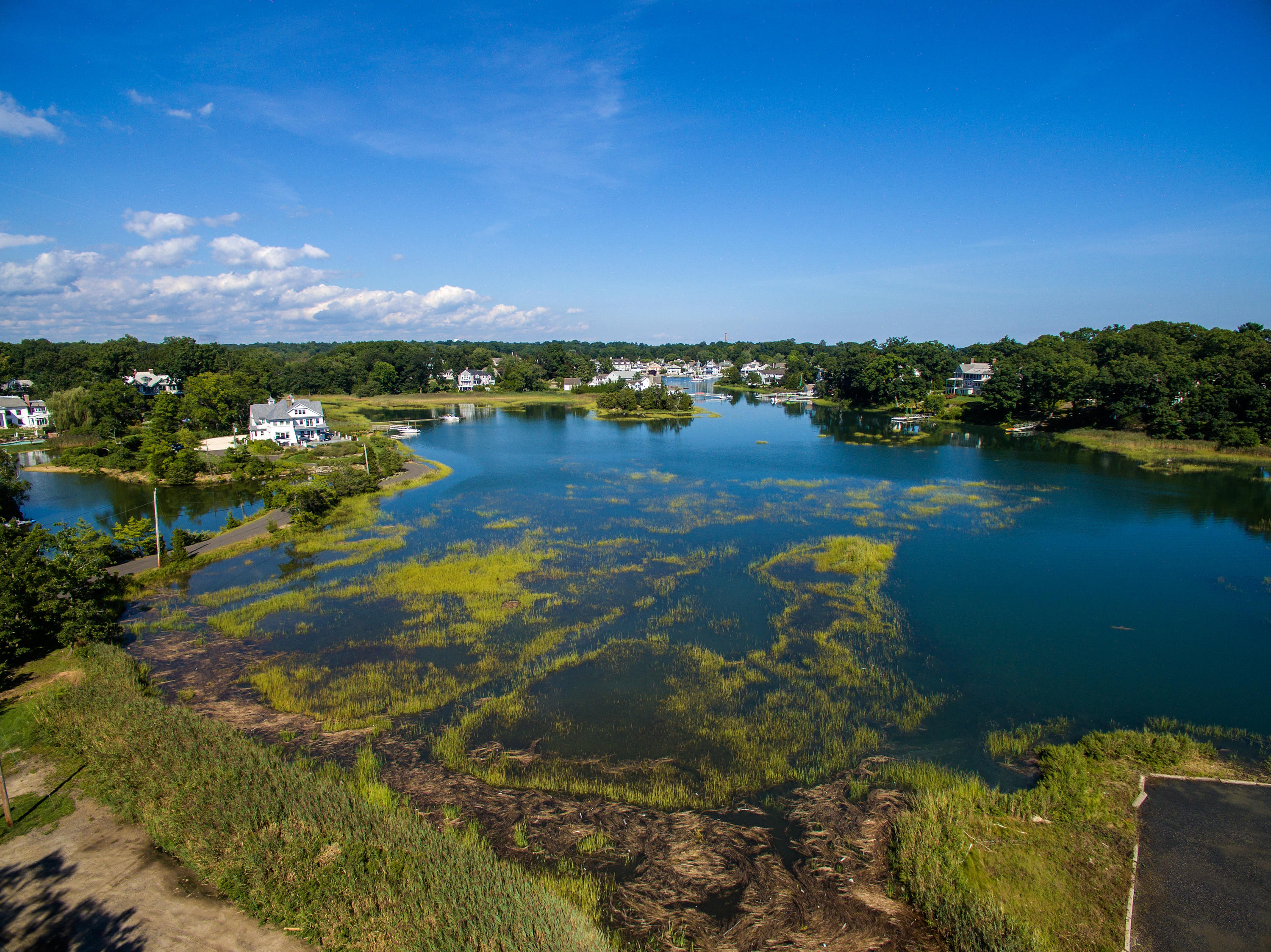 11 Contentment Island Road Darien, CT 06820 - Photo 27 of 31 a view of a lake with houses in the back