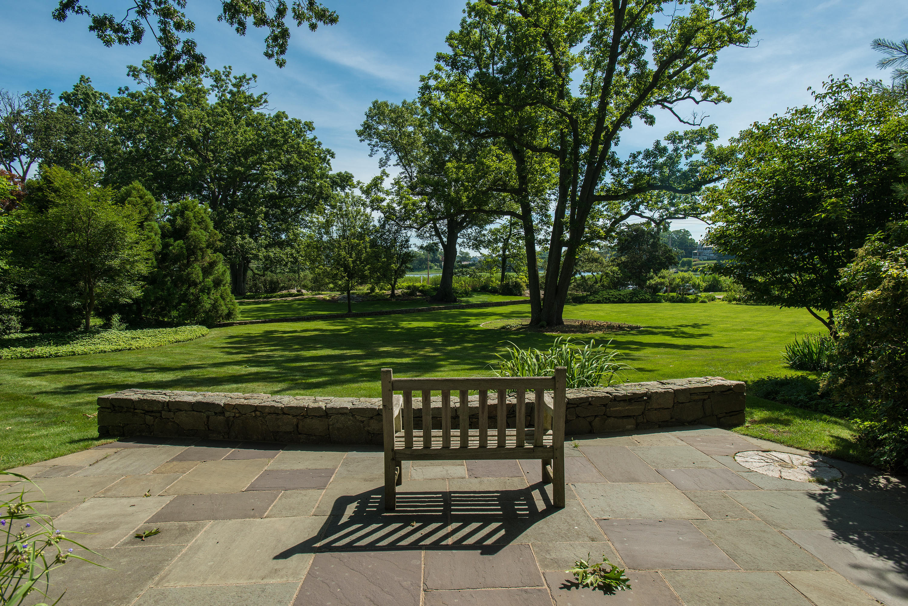 11 Contentment Island Road Darien, CT 06820 - Photo 8 of 31 a view of a bench in the garden