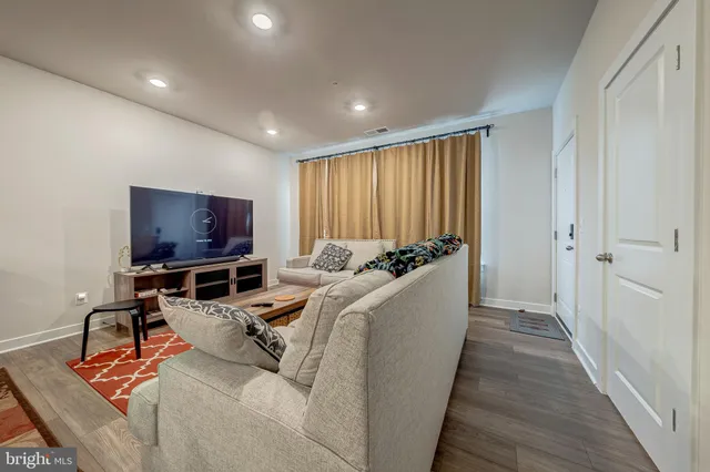 a room with furniture and a flat screen tv