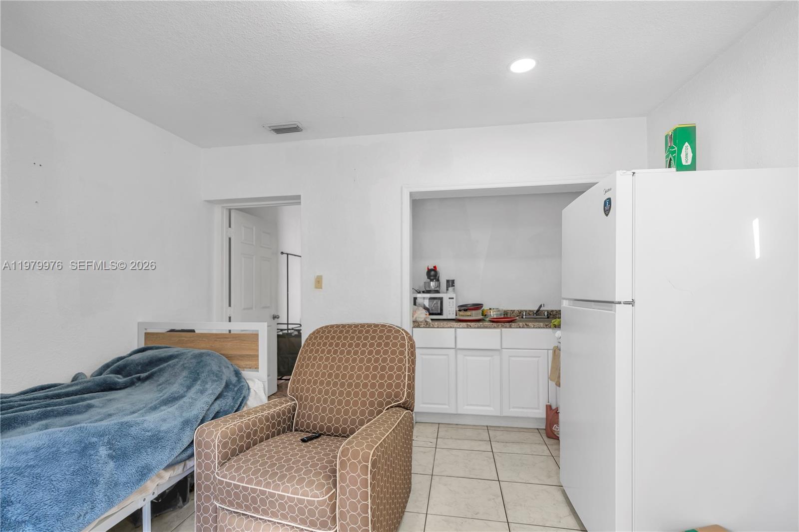 2900 Southwest 19th Street Miami, FL 33145 - Photo 11 of 24 a bedroom with a bed and a cabinets